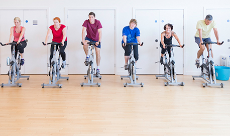 A busy spin class in session in the  sports centre